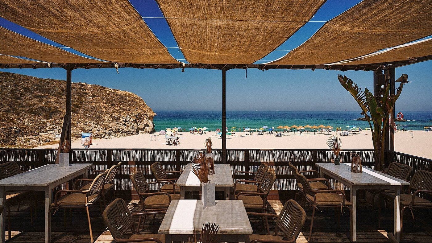 Shaded terrace tables at A.MAR looking down over Praia Grande and the sea