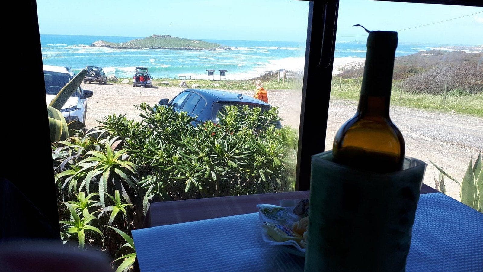 A window table at Restaurante A Ilha looking across the beach to Ilha do Pessegueiro